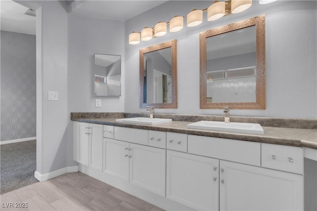 4644 Canna Dr, Las Vegas, NV 89122 - full bath with double vanity, a shower, wallpapered walls, and baseboards