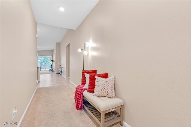 7070 Cinder Horse St, Las Vegas, NV 89131 - hallway with baseboards and light colored carpet