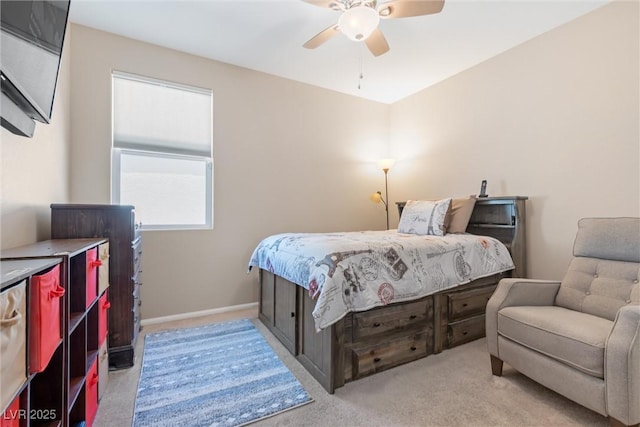 bedroom with light carpet, a ceiling fan, and baseboards