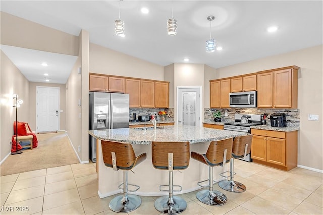 kitchen featuring stainless steel appliances, decorative backsplash, baseboards, light stone countertops, and recessed lighting