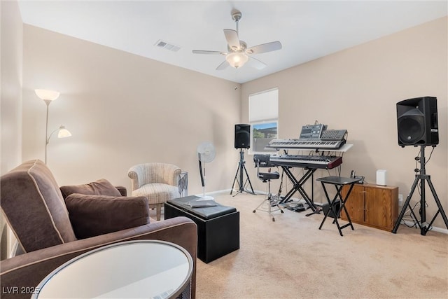 rec room with carpet, ceiling fan, and baseboards