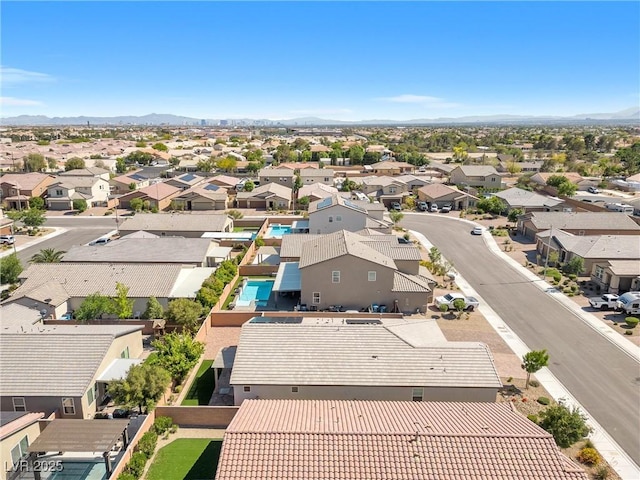 aerial view of residential area with mountains