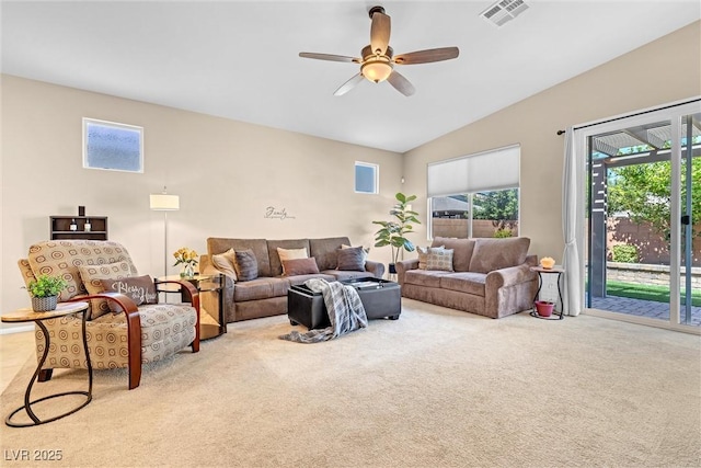 living room with carpet floors, ceiling fan, and vaulted ceiling