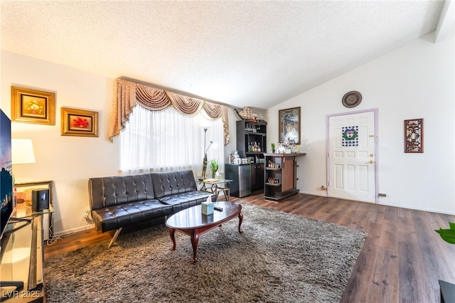 2261 Tall Pine Dr, Las Vegas, NV 89108 - living area with lofted ceiling, wood finished floors, baseboards, and a textured ceiling