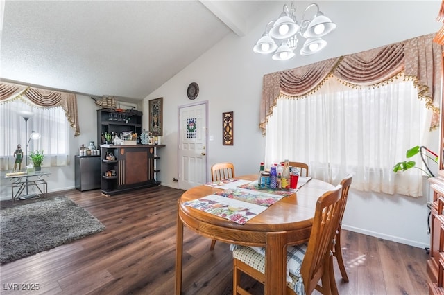 2261 Tall Pine Dr, Las Vegas, NV 89108 - dining space featuring a chandelier, beamed ceiling, baseboards, a bar, and wood finished floors