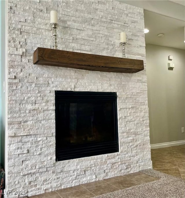 detailed view of baseboards and a fireplace