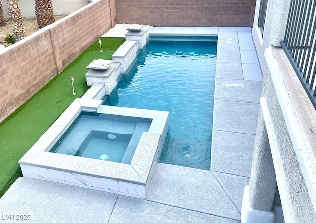 view of swimming pool with an area to practice putting, a pool with connected hot tub, and a fenced backyard