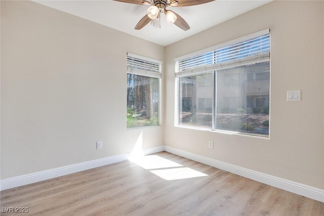 5217 Caspian Springs Dr Unit 101, Las Vegas, NV 89120 - unfurnished room with wood finished floors, ceiling fan, and baseboards