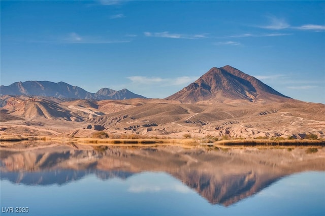 mountain view featuring a large body of water
