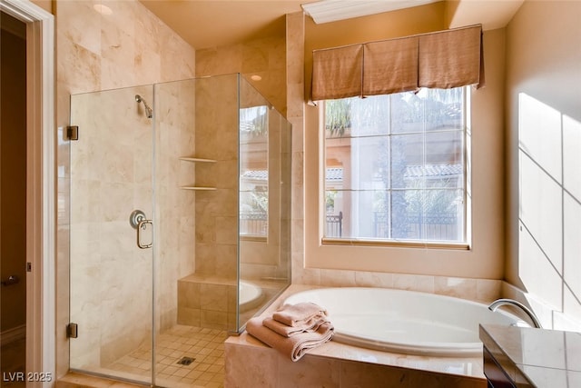 bathroom with a bath and a stall shower