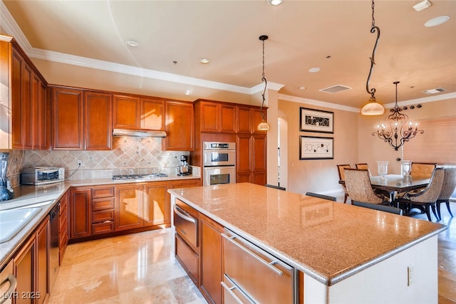 kitchen with crown molding, appliances with stainless steel finishes, a kitchen island, tasteful backsplash, and a warming drawer