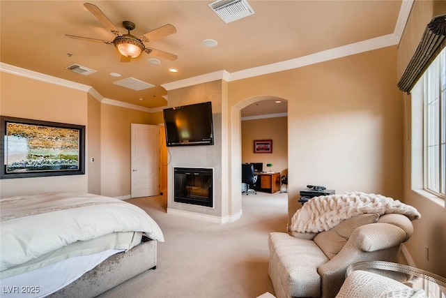 carpeted bedroom with a fireplace, ornamental molding, arched walkways, baseboards, and recessed lighting