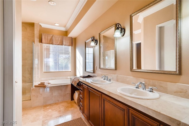 bathroom with crown molding, a garden tub, double vanity, and a tile shower