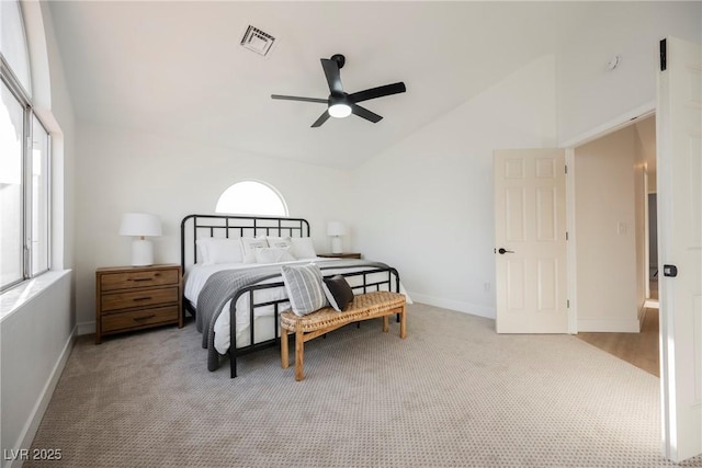 bedroom with lofted ceiling, multiple windows, carpet flooring, and baseboards