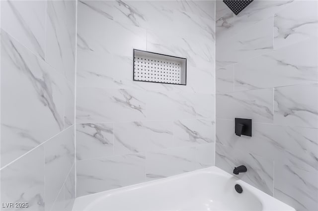 bathroom featuring washtub / shower combination