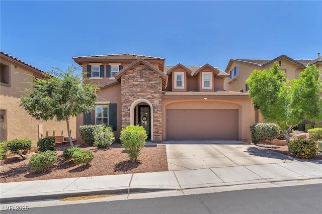 10353 Settlers Run Ave, Las Vegas, NV 89166 - view of front of house with stucco siding, stone siding, concrete driveway, a garage, and a tiled roof