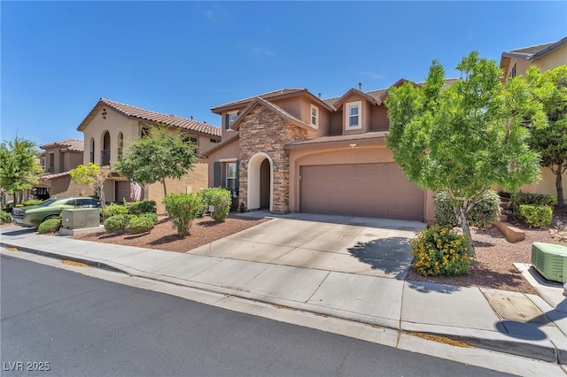 10353 Settlers Run Ave, Las Vegas, NV 89166 - mediterranean / spanish house featuring stucco siding, driveway, stone siding, an attached garage, and a tile roof