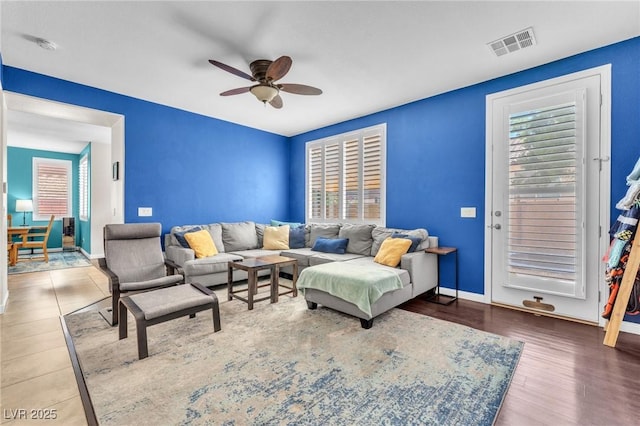 10353 Settlers Run Ave, Las Vegas, NV 89166 - living room with ceiling fan, baseboards, and wood finished floors