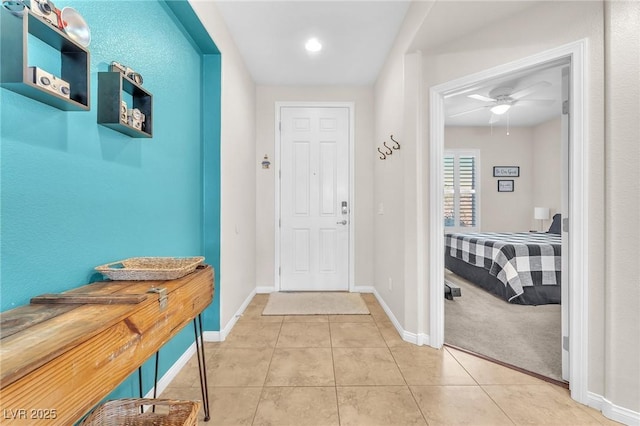 10353 Settlers Run Ave, Las Vegas, NV 89166 - foyer entrance with light tile patterned floors, baseboards, and ceiling fan