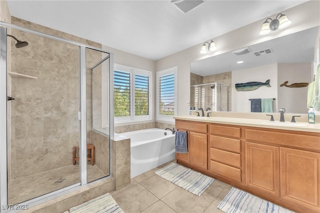 10353 Settlers Run Ave, Las Vegas, NV 89166 - bathroom featuring a shower stall, a bath, double vanity, and tile patterned floors