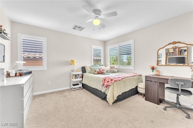 10353 Settlers Run Ave, Las Vegas, NV 89166 - bedroom with light colored carpet, a desk, baseboards, and a ceiling fan