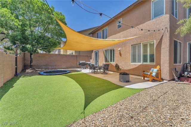 10353 Settlers Run Ave, Las Vegas, NV 89166 - back of house featuring stucco siding, a fenced backyard, and a patio