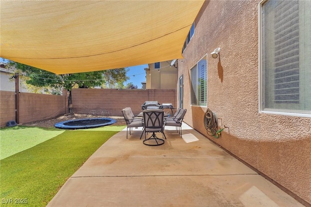 10353 Settlers Run Ave, Las Vegas, NV 89166 - fenced backyard with outdoor dining area and a patio area