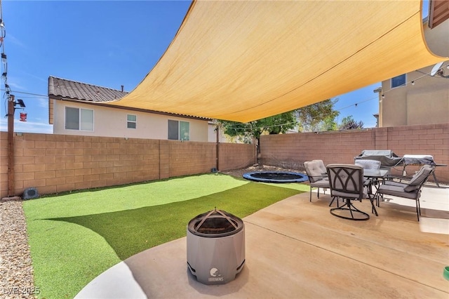 10353 Settlers Run Ave, Las Vegas, NV 89166 - fenced backyard with an outdoor fire pit, a patio, and outdoor dining area