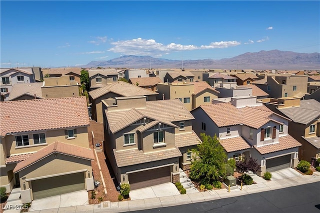 aerial view of residential area with mountains