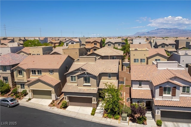 aerial view of residential area with a mountain backdrop