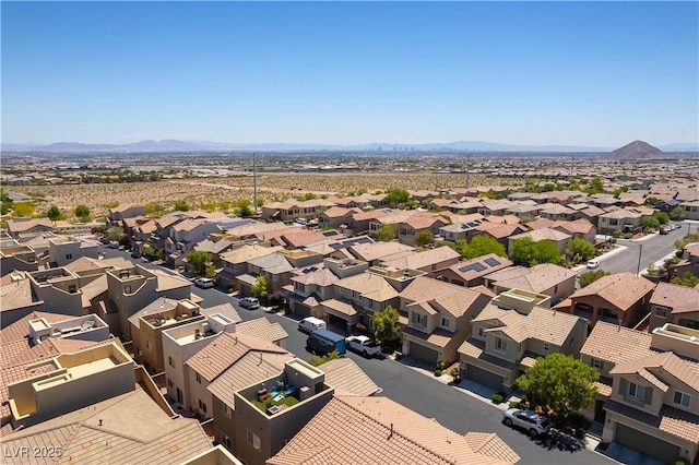 aerial perspective of suburban area with a mountainous background
