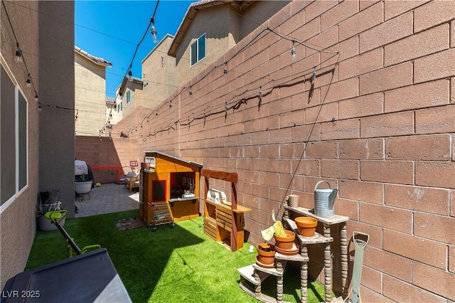 view of yard with fence and a patio area