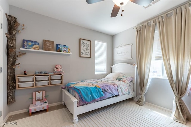 bedroom with baseboards and ceiling fan