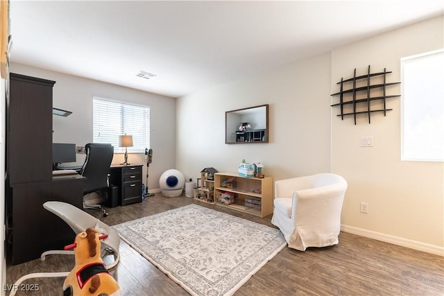 office space featuring wood finished floors and baseboards