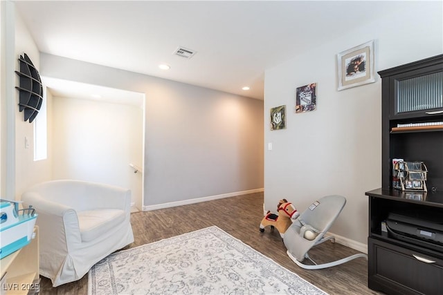 sitting room featuring wood finished floors, baseboards, and recessed lighting