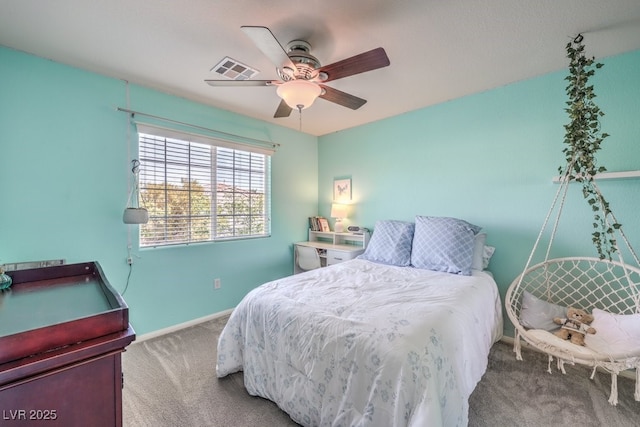 carpeted bedroom with baseboards and ceiling fan