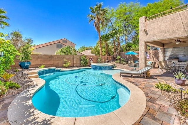 view of pool featuring a fenced backyard, ceiling fan, a patio area, outdoor dining area, and a pool with connected hot tub