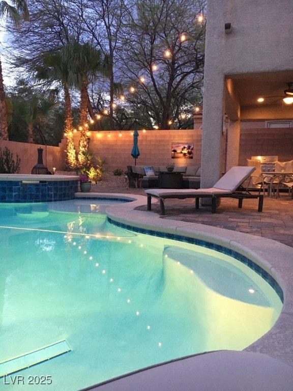 view of pool with a fenced backyard, a ceiling fan, a patio, and a jacuzzi