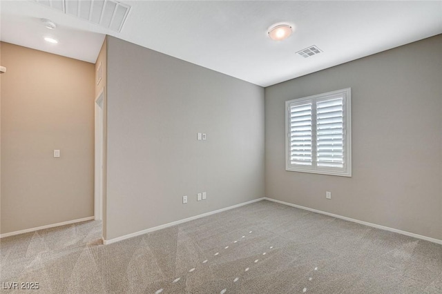 8562 Insignia Ave Unit 102, Las Vegas, NV 89178 - carpeted spare room featuring baseboards