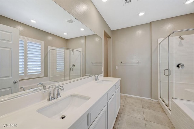 8562 Insignia Ave Unit 102, Las Vegas, NV 89178 - bathroom with a shower stall, recessed lighting, tile patterned flooring, double vanity, and a tub to relax in