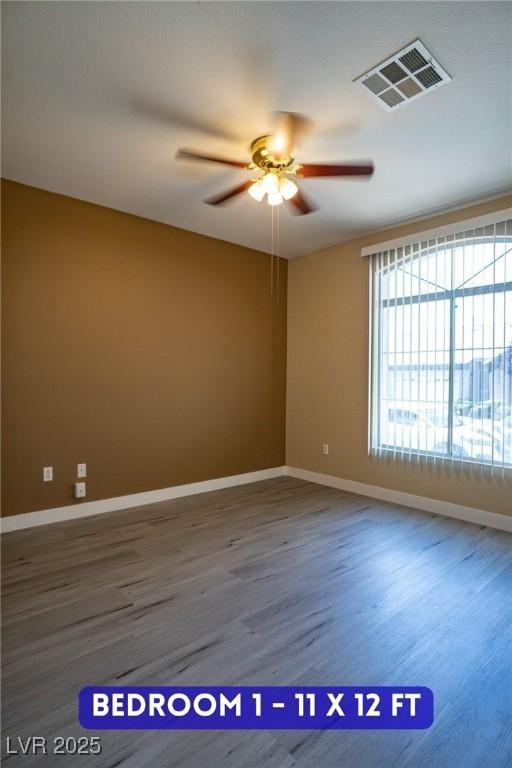 9710 Geiger Peak Ct, Las Vegas, NV 89148 - unfurnished room with a ceiling fan, wood finished floors, and baseboards
