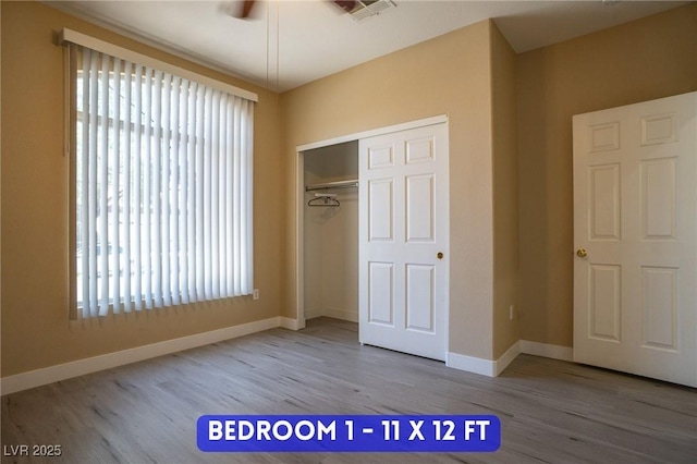 9710 Geiger Peak Ct, Las Vegas, NV 89148 - unfurnished bedroom featuring wood finished floors, a closet, and baseboards