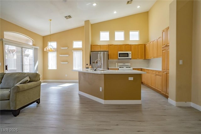 9710 Geiger Peak Ct, Las Vegas, NV 89148 - kitchen featuring white appliances, baseboards, light wood-style flooring, light countertops, and high vaulted ceiling