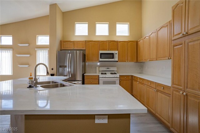 9710 Geiger Peak Ct, Las Vegas, NV 89148 - kitchen featuring white appliances, a sink, high vaulted ceiling, a kitchen island with sink, and decorative backsplash