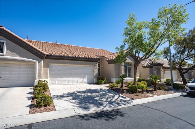 9710 Geiger Peak Ct, Las Vegas, NV 89148 - view of front facade featuring stucco siding, a tile roof, an attached garage, and driveway