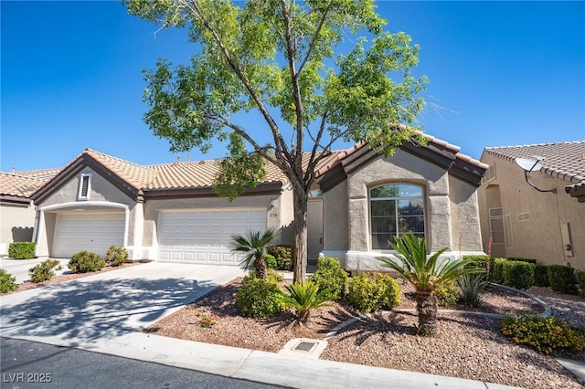 9710 Geiger Peak Ct, Las Vegas, NV 89148 - view of front of house featuring stucco siding, a garage, concrete driveway, and a tiled roof