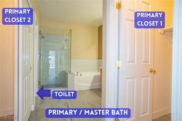 9710 Geiger Peak Ct, Las Vegas, NV 89148 - bathroom featuring a stall shower, a garden tub, and wood finished floors