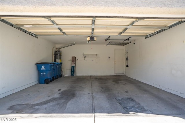 9710 Geiger Peak Ct, Las Vegas, NV 89148 - garage with a garage door opener and secured water heater