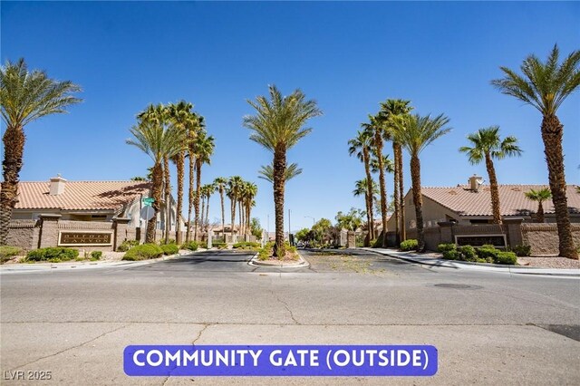 9710 Geiger Peak Ct, Las Vegas, NV 89148 - view of asphalt road featuring curbs and sidewalks