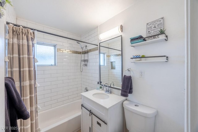 bathroom with vanity, shower / bath combo with shower curtain, and toilet